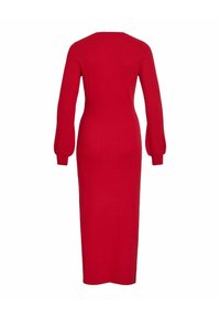 Abito rosso a maglia con maniche lunghe e gonfie, silhouette attillata e lunghezza alla caviglia. Realizzato in morbido tessuto elasticizzato per il massimo comfort.