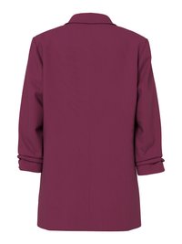 Pogled straga na sako tamnoljubičaste boje s dugim rukavima, s podvrnutim manšetama i jednostavnim ovratnikom na jednostavnoj pozadini.