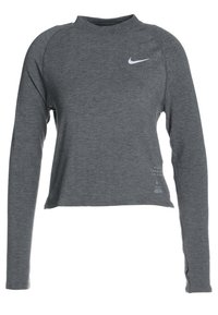 Grijze lange mouwen sportshirt, gemaakt van een gestructureerde stof, met een hoge halslijn en een klein wit Nike-logo op de borst.