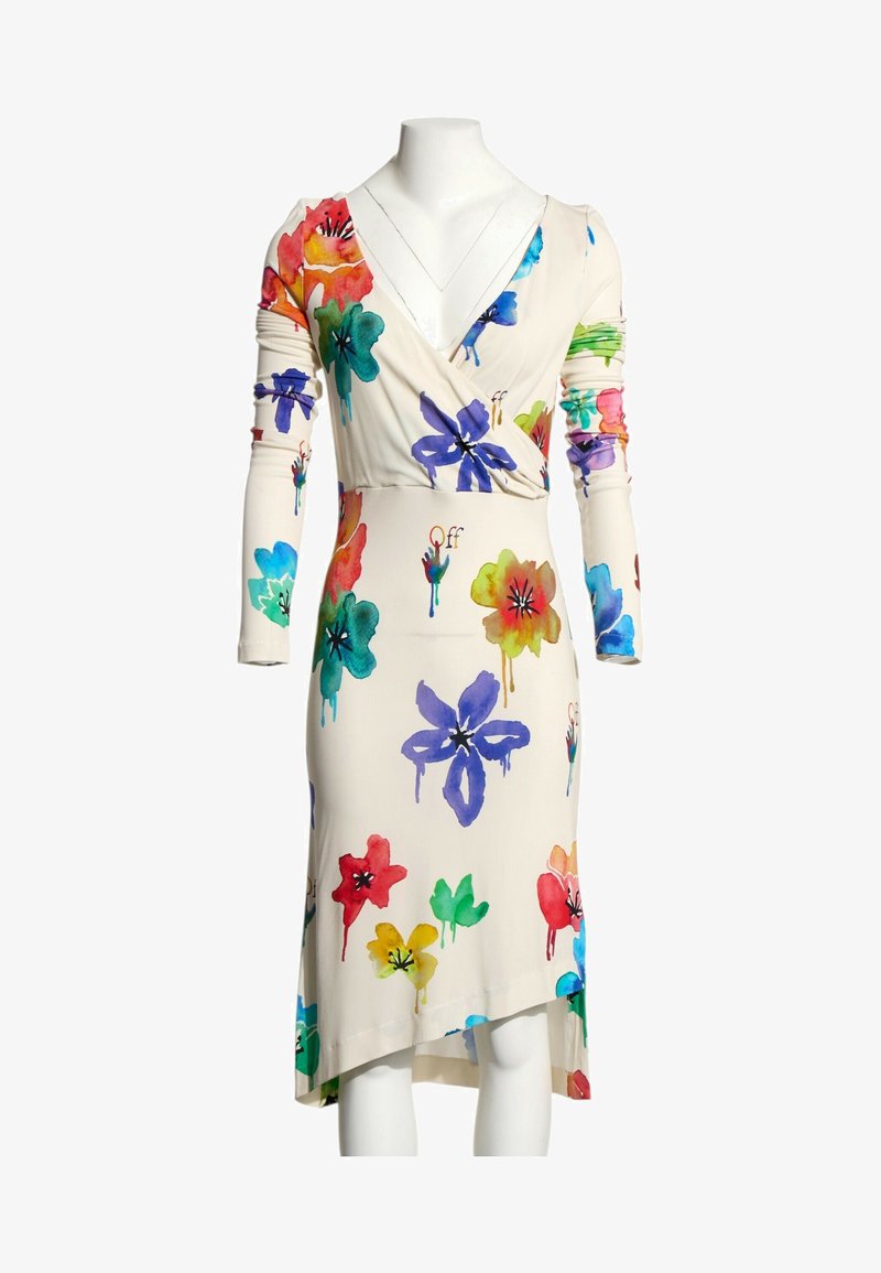 Robe crème à manches longues et col en V, avec de grandes impressions florales multicolores style aquarelle et un ourlet asymétrique.