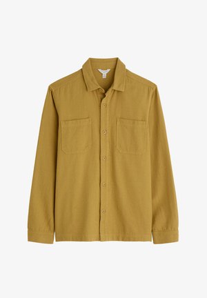 Majica dugih rukava od tkanine u senfu žutoj boji s teksturiranim završetkom, s klasičnom kragnom, dva prednja džepa na prsima i dugmadi.