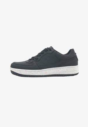 Black sneaker with smooth leather upper, round toe, and white speckled midsole. Features lace-up closure and textured black rubber sole.