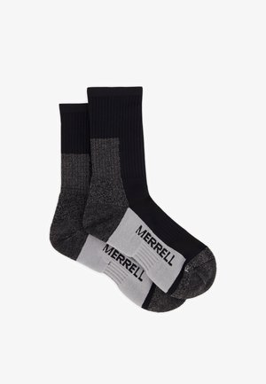 Par sorte og grå Merrell mellemhøje sokker med forstærket hæl, tå og støtte til svangen, lagt fladt på hvid baggrund.