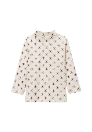 Haut en coton à manches longues couleur crème avec un motif floral répété en rouge et vert. Comprend un col montant et une fermeture à bouton au col.