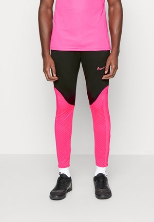 Schwarze Sporthosen mit lebhaften pinken Einsätzen, die ein strukturiertes geometrisches Muster aufweisen, Nikemarke auf dem Oberschenkel und dehnbarem Schnitt.