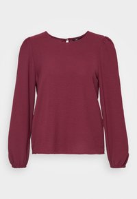 Mörkröd långärmad topp med rund halsringning, texturerad tyg och elastiska manschetter; har en liten nyckelhålsknäppning bak.