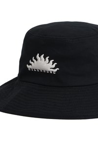 Black bucket hat made of textured fabric, featuring a white sun graphic and "BILLABONG" text on the front. Simple, functional design.