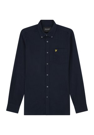 Chemise bleu marine à manches longues avec boutons, col boutonné et petit logo d'oiseau jaune sur la poche poitrine gauche.