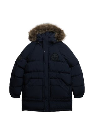 Puchowy granatowy płaszcz z kapturem wykończonym futrem, zamkiem błyskawicznym i zapięciem na napy, dwoma przednimi kieszeniami oraz okrągłym haftowanym logo na piersi.