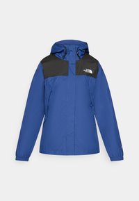 Veste imperméable bleue avec une partie supérieure noire, dotée d'une capuche et de poignets élastiques. Comprend le logo The North Face sur la poitrine.