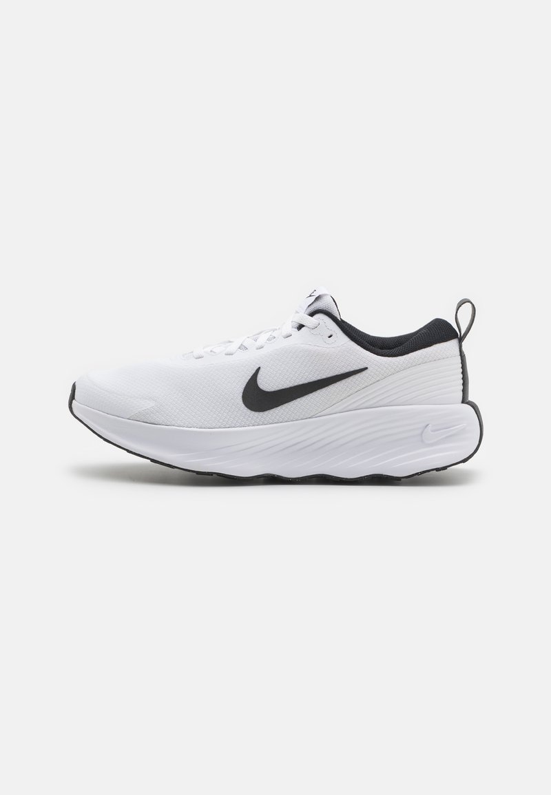 White athletic shoe with a breathable mesh upper, black accents, cushioned sole, and textured surface. Features a logo on the side and heel tab.
