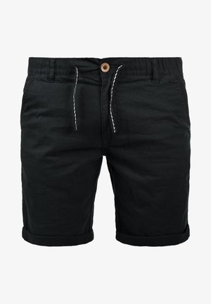 Zwarte katoenen shorts met een elastische tailleband, trekkoord en opgerolde boorden. Heeft zijzakken en een houten knoopdetail.
