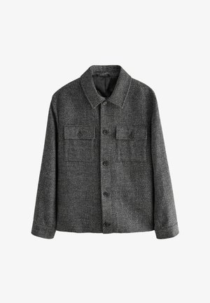 Grå tekstureret jakke lavet af uldblanding med krave, knaplukning, to brystlommer og en afslappet pasform. Velegnet til lag-på-lag styling.