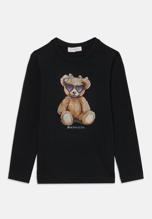 Long-sleeve black shirt featuring a teddy bear graphic adorned with rhinestones, wearing purple sunglasses and a bow. "#MONNALISA" below.