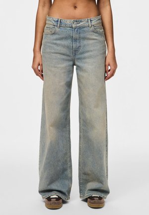 Wide-leg denim jeans in a light blue wash. Features a high waist, traditional five-pocket design, and subtle fading along the legs.