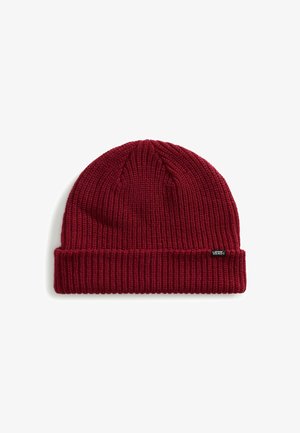 Beanie rosso in maglia con una trama a coste, dotato di un risvolto e un piccolo etichetta nera sul lato.