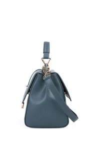 Blue textured leather handbag with gold hardware, top handle, and detachable shoulder strap shown from the side.