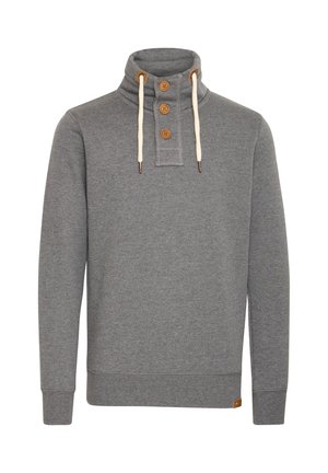Sudadera gris con cuello alto, tres botones de madera y cordones crema. Textura suave con puños y dobladillo acanalados.