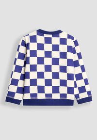 Maglietta a manica lunga con un motivo a scacchi blu e crema. Realizzata in morbido cotone, presenta un colletto rotondo e polsini a costine.