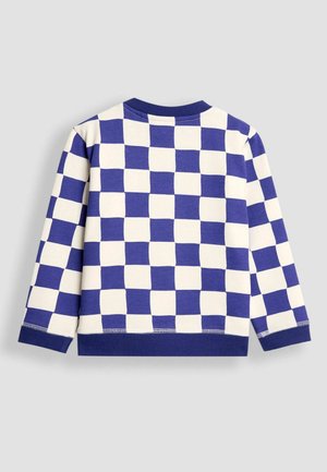 Dlhý rukáv s modro-bežovým kockovaným vzorom. Vyrobené z mäkkej bavlny, s okrúhlym výstrihom a rebrovanými manžetami.