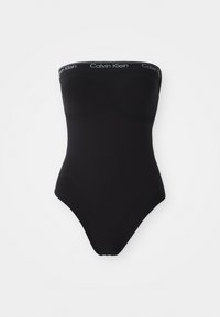Černé jednodílné plavky bez ramínek s bezšvým designem. V horní části je elastický pás s logem Calvin Klein a plavky mají výše vykrojené nohavičky.