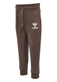 Braune Jogginghosen aus weichem Stoff, mit einem Kordelzugbund und gerippten Säumen. Mit einem weißen Logo auf der Vorderseite.