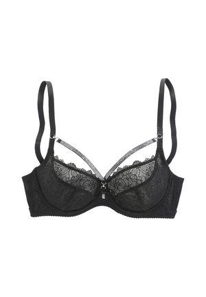 Reggiseno in pizzo nero con motivi floreali, spalline regolabili e sottili cinturini decorativi che uniscono le coppe al centro davanti.
