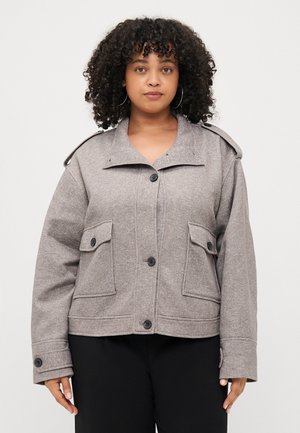 Gray wool blend jacket with a cropped design, large front pockets, button closures, and shoulder epaulets. Smooth texture, relaxed fit.