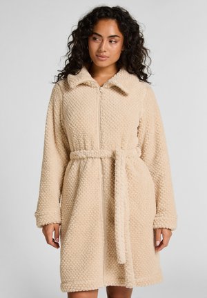Beige Plüsch-Bademantel mit strukturiertem Stoff, Reißverschluss, Kragen und einem gebundenen Gürtel in der Taille. Lange Ärmel mit Manschettenverzierung.