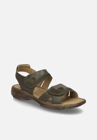 Hnědé kožené sandály s dvěma nastavitelnými popruhy, výřezovým designem, polstrovanou stélkou a nízkým profilem podešve pro pohodlí a oporu.