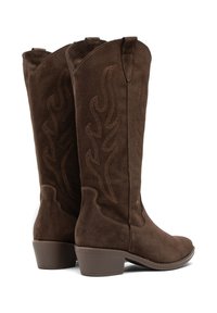 Pair of mid-calf brown suede cowboy boots with flame-pattern stitching and low block heels, viewed from the back and side.