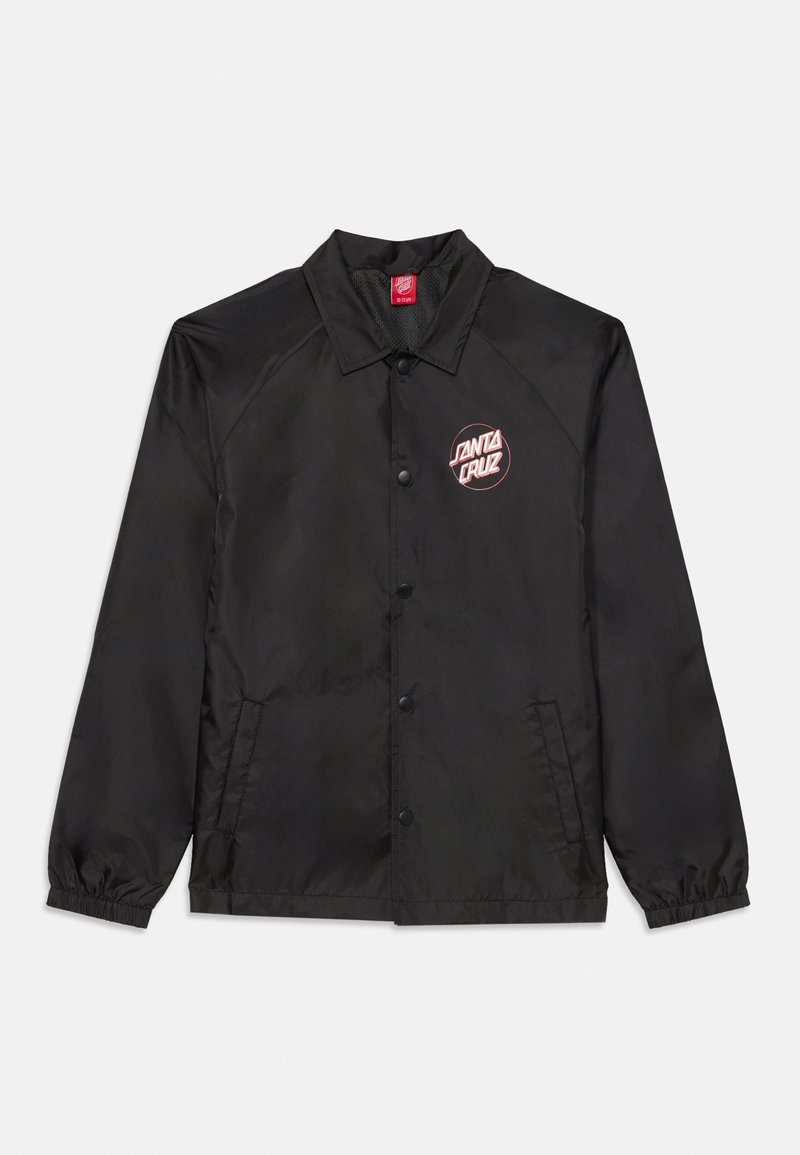 Svart vindjacka med knäppning, raglanärmar, elastiska ärmslut och en röd cirkulär logotyp med texten "SANTA CRUZ" på bröstet.