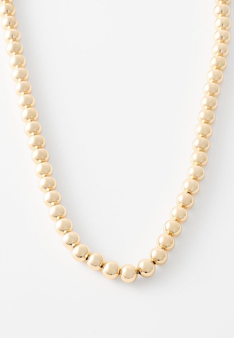 Collana di perline color oro con perle sferiche lucide di dimensioni uniformi, caratterizzata da una finitura metallica liscia e un design flessibile.