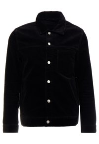 Svart kordflanelljacka med knappstängning fram, två bröstfickor och krage. Har texturerat tyg och silverfärgade metallknappar.