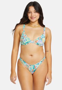 Floral bikini set featuring a blue-green base with multicolored flowers. The top has wide straps and underwire; bottom is a low-rise, thong style.