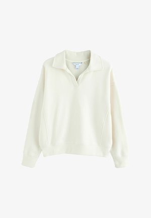 Kermanvärinen, ylhäältä vedettävä huppari, jossa on leveä kaulus, ribbitekstuuri ja sivusaumasaumat. Ominaisuuksiin kuuluu pitkät hihat ja rento istuvuus.