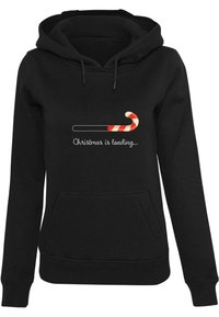 Black hoodie featuring a front pocket, drawstrings, and a graphic with a candy cane and text "Christmas is loading..." in white.