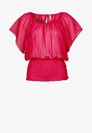 Blouse rose vif en tissu transparent à petits pois blancs, manches larges chauve-souris, taille élastique et fermeture par bouton à l'encolure avec ouverture en trou de serrure.