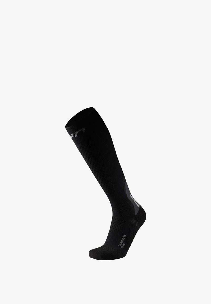 Black knee-high compression sock with textured pattern, smooth top, reinforced toe, and reflective accent detail. Lightweight, snug fit.