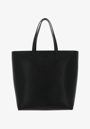 Black leather tote bag with two handles and subtle crocodile logo centered near top edge.