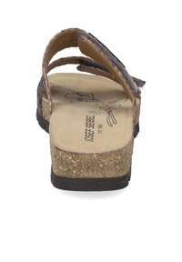 Braune Sandale mit Korksohle, weichem grauen Riemen und strukturiertem Fußbett. Verfügt über einen Fersenriemen für einen sicheren Sitz. Minimalistisches Design, offene Zehenform.