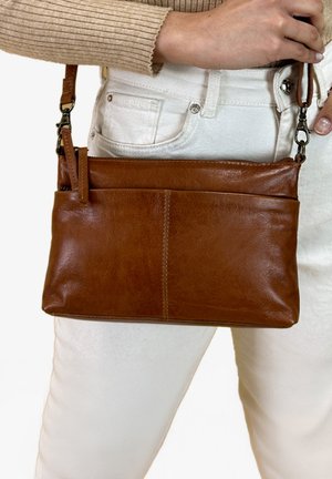 VERONIKA - Cross body bag - braun