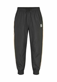 Pantalon de sport noir avec taille et poignets élastiques, poches latérales, bandes latérales beiges et logo de la marque sur la cuisse droite.