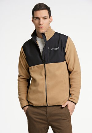 Beige und schwarze Reißverschlussjacke aus Fleece, mit hohem Kragen, Logo auf der Brust und zwei Seitentaschen. Strukturierte Stoffmischung.