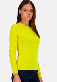 Bright yellow long-sleeve sweater with a round neckline, made from a soft, textured fabric, features a fitted shape and smooth finish.