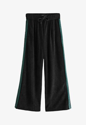 Schwarze, weit geschnittene Hosen aus weichem Cordstoff. Mit grünen Seitenstreifen und einem Kordelzugbund für eine verstellbare Passform.