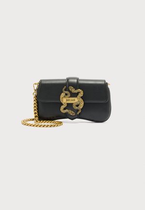 Black leather shoulder bag with gold chain strap and decorative gold snake buckle featuring "Just Cavalli" logo.