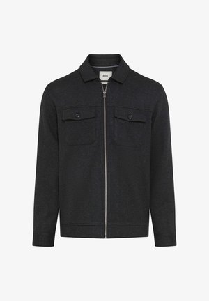 Schwarze Zip-Jacke mit zwei Brusttaschen, Kragen und langen Ärmeln. Hergestellt aus strukturiertem Stoff mit strukturierter Passform.