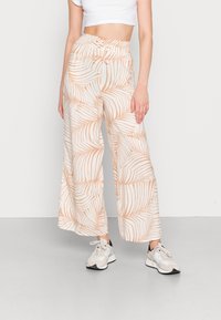 Wide-leg trousers in lightweight fabric featuring a cream background with light orange palm leaf patterns, and an elastic waistband.