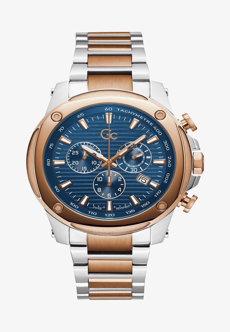 Sidabrinė ir rožinė auksinė nerūdijančio plieno riešo laikrodis su mėlynai struktūruotu ciferblatu, chronografu su kūdikių subdiali bei datos rodmeniu. Ypatybės: švytinčios rodyklės ir žymekliai.